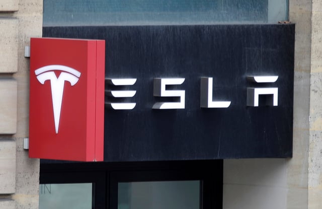 The logo of Tesla is seen on a store in Paris, France, October 30, 2020. REUTERS/Charles Platiau