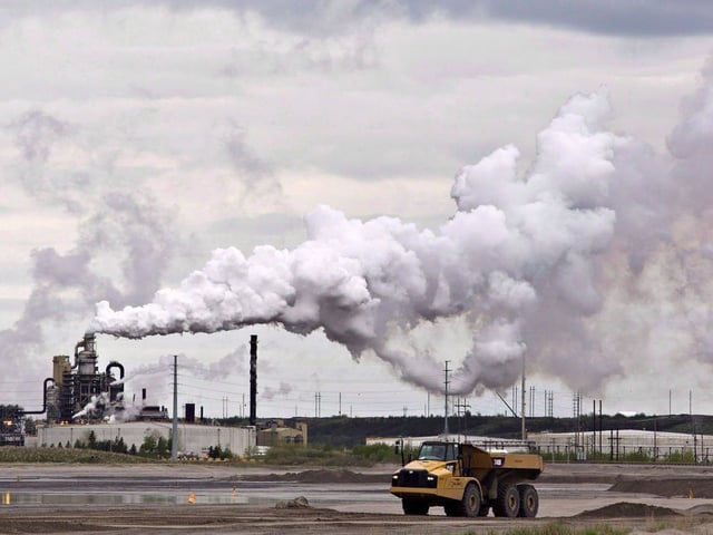 A dump truck works near an oil sands extraction facility near Fort McMurray, Alta.