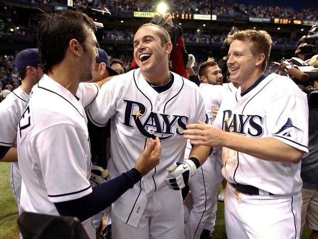 FILE - In this Sept. 29, 2011, file photo, Tampa Bay Rays&#39; Evan Longoria, center, celebrates with teammates Sean Rodriguez, left, and Elliot Johnson after his home run that defeated the New York Yankees 8-7 and clinched the AL wild card for the Rays, after a baseball game in St. Petersburg, Fla. The San Francisco Giants have acquired infielder Evan Longoria and cash from the Tampa Bay Rays for outfielder Denard Span, infielder Christian Arroyo and two minor league pitchers. The teams announced the moves Wednesday, Dec. 20, 2017. (AP Photo/Chris O&#39;Meara, File)