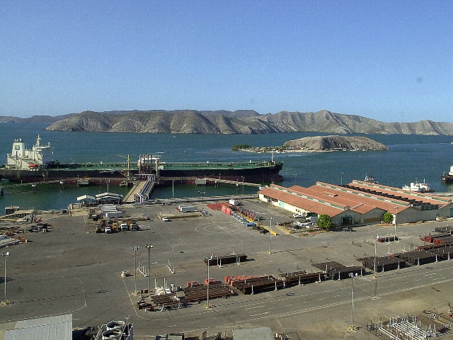Two oil tankers are seen loading crude at the port of Puerto la Cruz, about 300 kilometers, 186 miles of Caracas, Venezuela, Wednesday, Feb. 12, 2003. Foreign shipping agencies have been distrustful of the safety of Venezuelan ports, where many workers have been replaced. But in a sign of growing confidence in the safety of Venezuelan ports, U.S. oil giant Exxon Mobil plans to load 525,000 barrels of synthetic crude at the Jose Terminal next week, said the port'sloading manager. (Fernando Llano/AP)