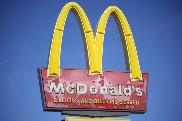 FILE - A sign with the company logo stands over a McDonalds restaurant on South Colorado Boulevard in Denver, Sunday, Oct. 24, 2021. (AP Photo/David Zalubowski, file)
