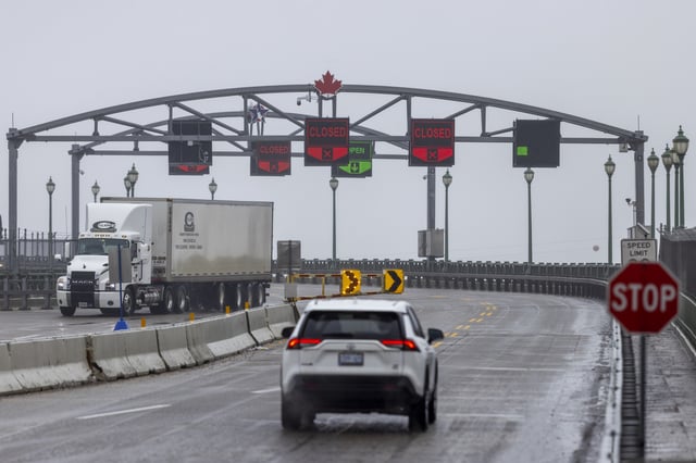 Vehicles drive across the Peace Bridge between the United States and Canada, Thursday, Feb. 27, 2025, in Buffalo, N.Y. 