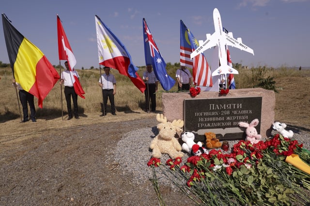 Flowers and toys put at a symbolic place in memory of killed passengers at the crash site of Malaysia Airlines Flight 17 near the village of Hrabove, in Russian-controlled Donetsk region, eastern Ukraine on Wednesday, July 17, 2024. Relatives of passengers killed when Malaysia Airlines Flight 17 was shot down over Ukraine have gathered with officials at Australia's Parliament House to mark the 10th anniversary of the tragedy that claimed 298 lives. 
