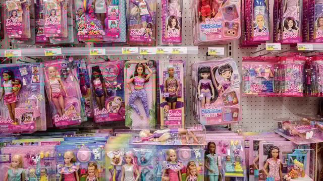An aisle of dolls at a store 