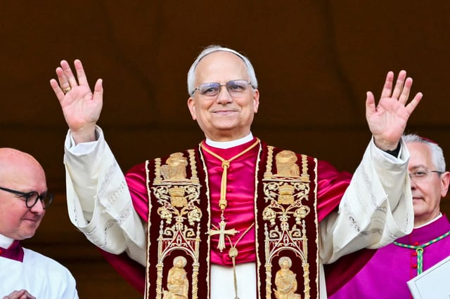 Newly elected Pope Leo XIV arrives on the main central loggia balcony of the St Peter&#39;s Basilica for the first time, after the cardinals ended the conclave.