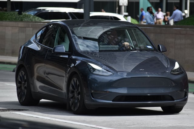 FILE: A gray Tesla sedan. A 39-year-old Tesla driver was arrested in Hawaii after allegedly assaulting another driver.