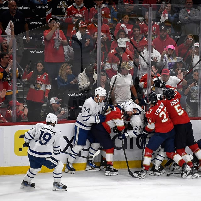 Florida Panthers players clash with Toronto Maple Leafs players after Game 4 of a second-round NHL hockey playoff series, Sunday, May 11, 2025, in Sunrise, Fla. (AP Photo/Michael Laughlin)