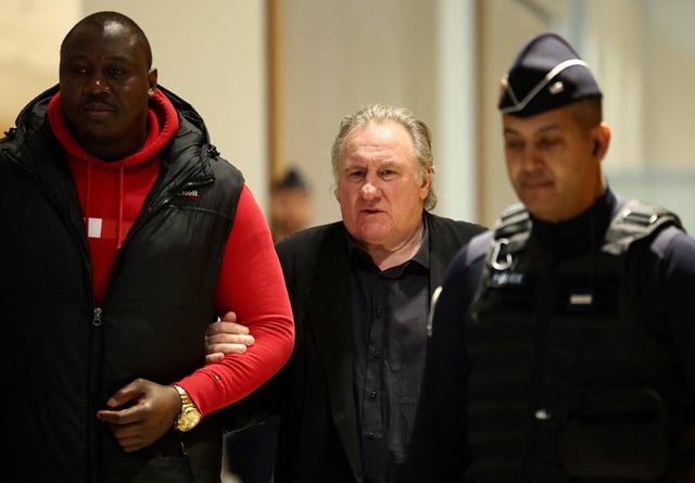 French actor Gerard Depardieu appears at the courthouse, as his trial over accusation of sexual assault on two women, which prosecutors say took place during the filming of "Les Volets Verts", continues in Paris, France, March 27, 2025. REUTERS/Abdul Saboor/File Photo