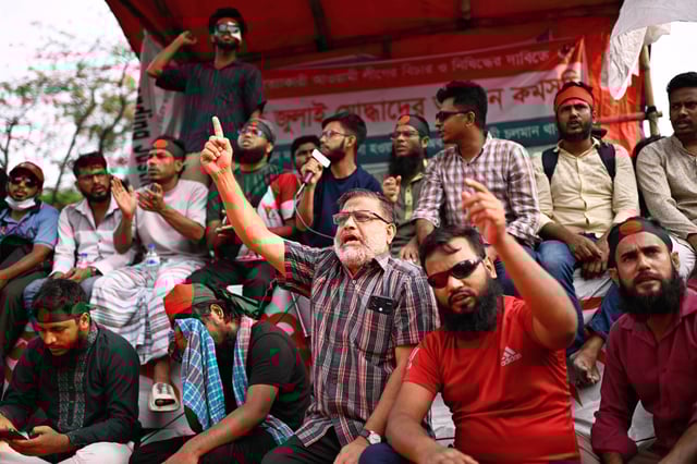 Protesters, some who were injured in protests against former Prime Minister Sheikh Hasina last year, demand a ban on her Awami League party, in Dhaka, Bangladesh, Sunday, May 11, 2025. (AP Photo/Mahmud Hossain Opu)