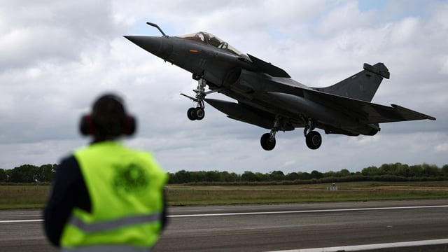 A French fighter aircraft Rafale M, manufactured by Dassault Aviation, takes part in a practice session for a simulated landing on an aircraft carrier at the Landivisiau Navy Air Base (BAN Landivisiau) in Saint-Servais, Brittany, in France.