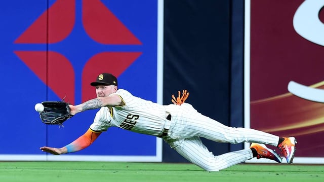 Jackson Merrill (3) of the San Diego Padres makes a diving catch for a fly ball hit by Zach Neto (9) of the Los Angeles Angels during the fifth inning of a game at Petco Park on Monday, May 12, 2025, in San Diego. (Sean M. Haffey/Getty Images/TNS)