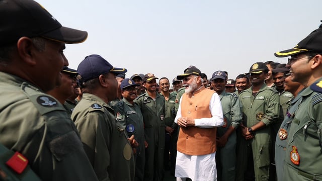 Prime Minister Narendra Modi interacting with armed forces personnel at the Adampur air base on Tuesday. 