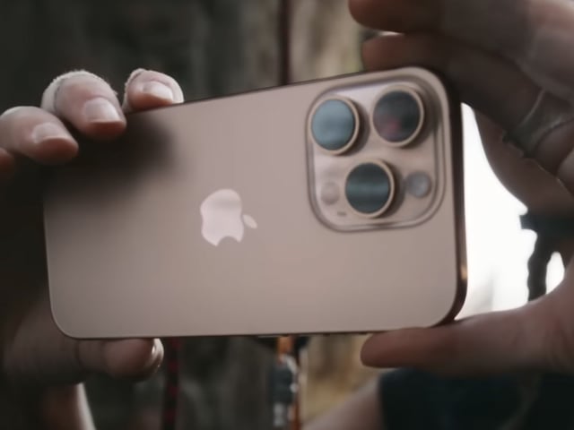 Two hands holding the iPhone 16 Pro showing its cameras