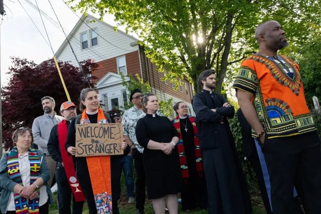 Faith leaders listen to a speaker at a protest against Avelo Airlines&#39; deportation flights outside Tweed New Haven Airport on May 12, 2025. Credit: Shahrzad Rasekh / CT Mirror