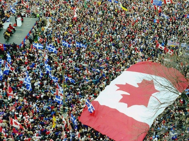 A huge Canadian flag marks a rally in support of Canadian unity days before the 1995 Quebec referendum.



(MONTREAL, QUE.: OCTOBER 27, 1995 --   AN OVERSIZE MAPLE LEAF FLAG MARKS A RALLY THAT DREW HUGE CROWDS TO PLACE DU CANADA IN SUPPORT OF CANADIAN UNITY ON OCT. 27, 1995, THREE DAYS BEFORE QUEBECERS VOTED IN THE REFERENDUM. (GORDON BECK/MONTREAL  GAZETTE)   For Mark Kennedy