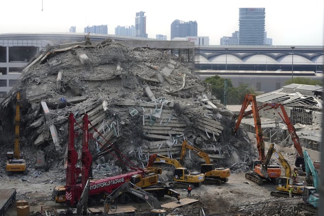 FILE - Heavy machineries are deployed to clear the rubble from an under construction high-rise building that collapsed after Friday's earthquake in Bangkok, Thailand, on April 2, 2025. (AP Photo/Manish Swarup, File)