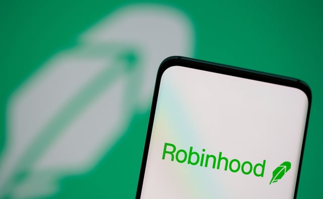Robinhood logo is seen on a smartphone in front of a displayed same logo in this illustration taken, July 2, 2021. REUTERS/Dado Ruvic/Illustration