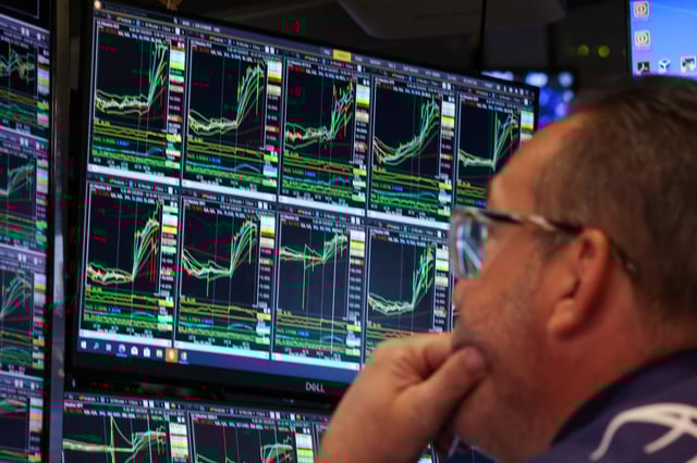 Traders work on the floor at the New York Stock Exchange (NYSE) in New York City, U.S., May 12, 2025.  REUTERS/Brendan McDermid/File photo