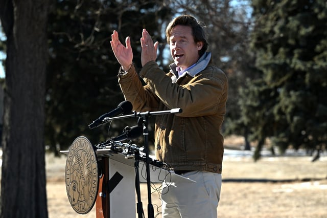 Denver Mayor Michael Johnston claps about the success of the City’s plans for the Park Hill Golf Club as he speaks to a large gathering of Park Hill residents and supporters during a press conference at the Park Hill Golf Club in Denver on Jan. 15, 2025. The city has acquired the golf course through a land trade and plans to turn it into a park. It is the largest private land acquisition in the city’s history. It is also the largest addition to Denver Parks and Recreation since 1911.  Johnston was joined by former Denver Mayor Wellington Webb, Denver City council member Shontel Lewis and other Park Hill Community members to announce the acquisition and the plans for the future of the Park Hill Golf Course. (Photo by Helen H. Richardson/The Denver Post)