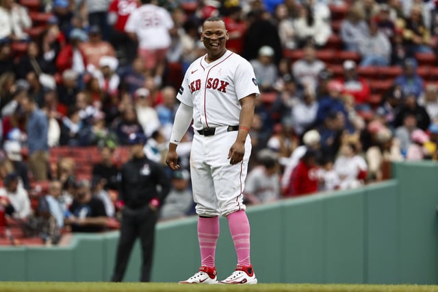 BOSTON, MA - MAY 12: Rafael Devers #11 of the Boston Red Sox smiles during the eighth inning against the Washington Nationals at Fenway Park on May 12, 2024 in Boston, Massachusetts.