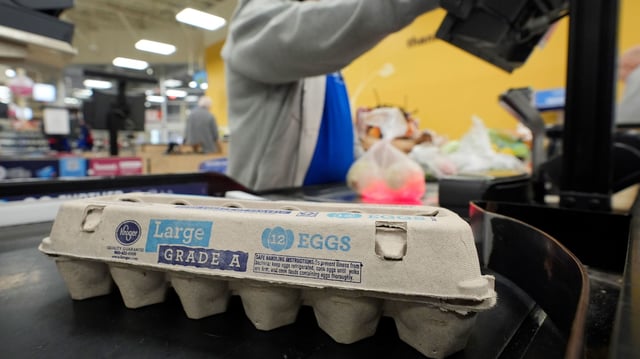 Cashier Josh Jimenez rings up egg for sale at a grocery store on February 7 in Dallas.