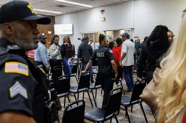 Officers remove the entire audience after several attendees clapped in support of speakers during public comments at the Harvey City Council meeting May 12, 2025. (Armando L. Sanchez/Chicago Tribune)