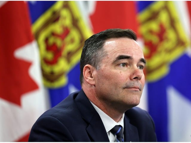 Fisheries Minister Kent Smith announces that the province will lift the moratorium on fish buyer and fish processing licensing, during a news conference in Halifax on Tuesday.
