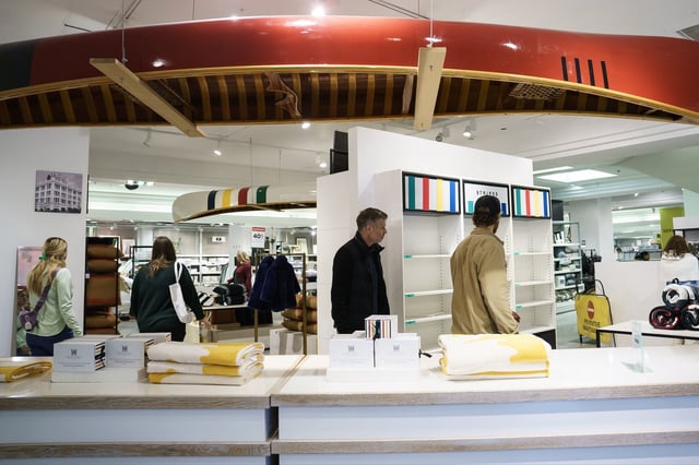 Shoppers browse a Hudson's Bay store in Toronto on Monday, March 17, 2025. THE CANADIAN PRESS/Christopher Katsarov