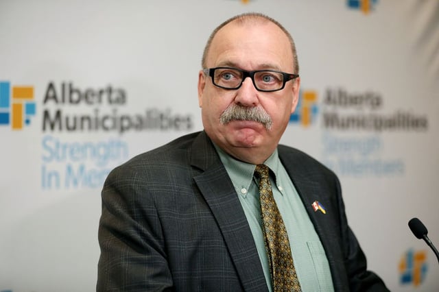 Municipal Affairs Minister Ric McIver speaks to the media following his speech to the Albert Municipalities Spring Leaders Convention, in Edmonton Thursday March 6, 2025. Photo by David Bloom