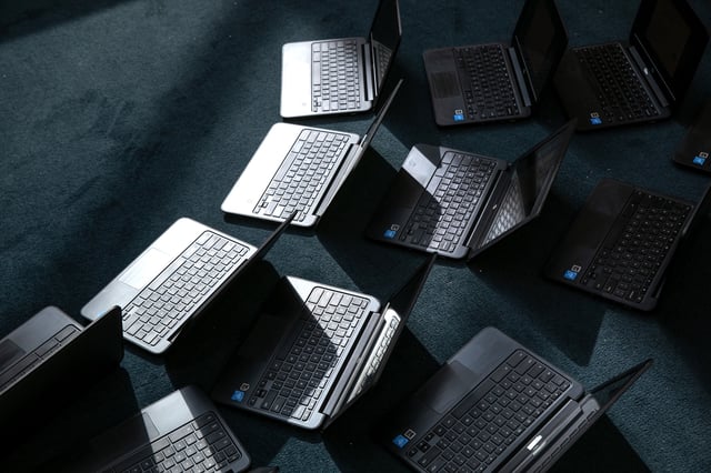 Chromebooks lie out after being cleaned in preparation for the Sept. 8 start of school at Newfield Elementary School on August 31, 2020 in Stamford, Connecticut.
