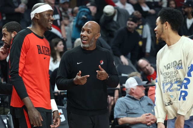 Apr 13, 2025; Portland, Oregon, USA;  Portland Trail Blazers head coach Chauncey Billups (middle) shares a moment with Portland Trail Blazers center Duop Reath (26) (left) and Portland Trail Blazers guard Anfernee Simons (1) before the Portland Trail Blazers play Los Angeles Lakers at Moda Center. Mandatory Credit: Jaime Valdez-Imagn Images/File Photo