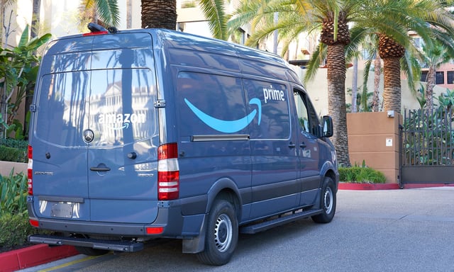 An Amazon Prime delivery van parked on a street.