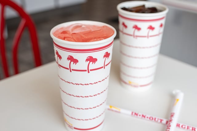 A cup of pink lemonade and a cup of Diet Coke sit on a table at In-N-Out in Los Angeles on July 17, 2024.