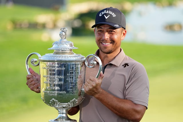 Xander Schauffele holds The Wanamaker Trophy after winning the PGA Championship golf tournament at Valhalla Golf Club.