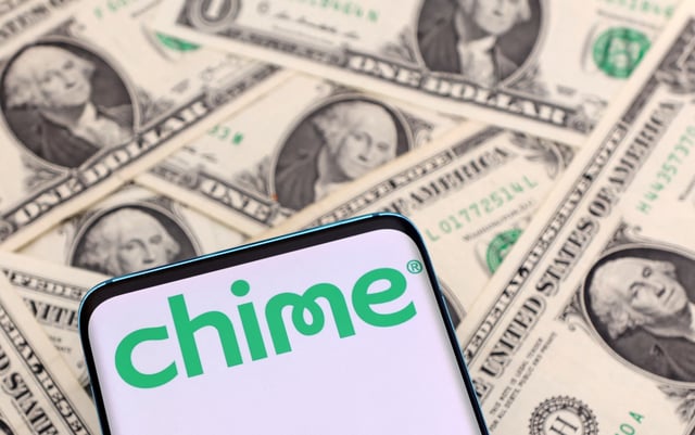 The Chime logo is seen on a smartphone placed on U.S. dollars banknotes in this illustration taken January 24, 2022. REUTERS/Dado Ruvic/Illustration/File Photo