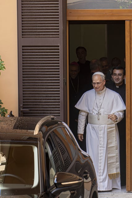Pope Leo XIV leaves the Augustinian General House in Rome after a visit, Tuesday, May 13, 2025. (AP Photo/Domenico Stinellis)