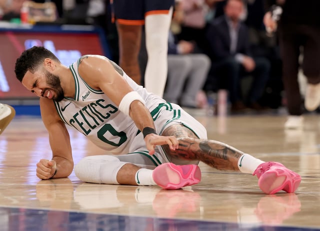 NEW YORK, NEW YORK - MAY 12:  Jayson Tatum #0 of the Boston Celtics lays on the ground after being injured against the New York Knicks during the fourth quarter in Game Four of the Eastern Conference Second Round NBA Playoffs at Madison Square Garden on May 12, 2025 in New York City. NOTE TO USER: User expressly acknowledges and agrees that, by downloading and or using this photograph, User is consenting to the terms and conditions of the Getty Images License Agreement. (Photo by Elsa/Getty Images). (Photo by Elsa/Getty Images)