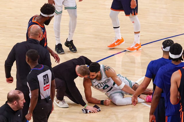 Medical staffers tend to Celtics forward Jayson Tatum after he was injured in the fourth quarter of Game 4 in an Eastern Conference semifinal series against the Knicks.