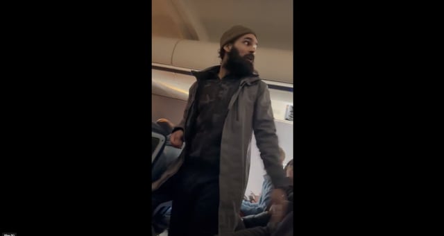 Francisco Severo Torres, seen on a plane from Los Angeles to Boston where he allegedly tried to open an emergency exit and later stab a flight attendant. 