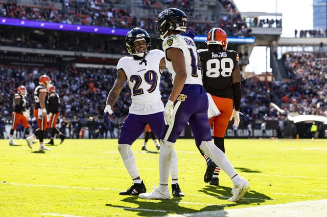 Kyle Hamilton #14 of the Baltimore Ravens celebrates with Ar&#39;Darius Washington #29 after blocking a pass intended for Jordan Akins #88 of the Cleveland Browns in the second quarter of the game at Huntington Bank Field on October 27, 2024 in Cleveland, Ohio. The Browns beat the Ravens 29-24.