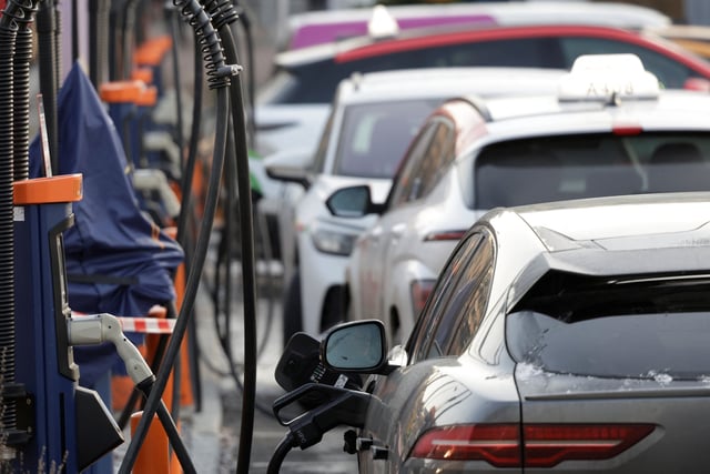 Cars get charged at a charging point in Oslo, Norway, December 11, 2024. REUTERS/Leonhard Foeger/ File Photo