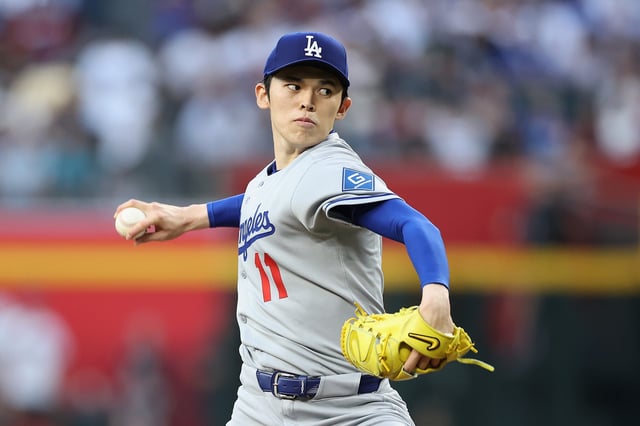 PHOENIX, ARIZONA - MAY 09: Starting pitcher Roki Sasaki #11 of the Los Angeles Dodgers pitches against the Arizona Diamondbacks during the first inning of the MLB game at Chase Field on May 09, 2025 in Phoenix, Arizona.