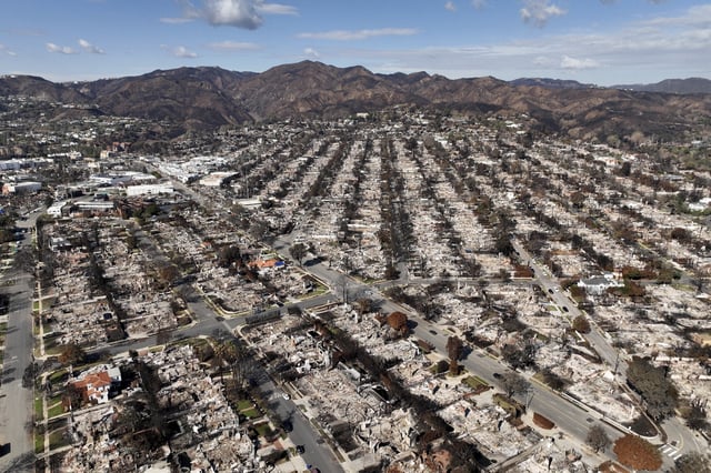 FILE - The devastation from the Palisades Fire is shown in an aerial view in the Pacific Palisades neighborhood of Los Angeles, Monday, Jan. 27, 2025. (AP Photo/Jae C. Hong, File)