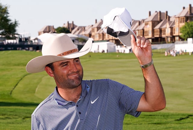 May 4, 2025; McKinney, Texas, USA; Scottie Scheffler celebrates with the winner's trophy during the final round of the THE CJ CUP Byron Nelson golf tournament. Scheffler won with a score of 31-under par for the tournament. Mandatory Credit: Raymond Carlin III-Imagn Images/File Photo
