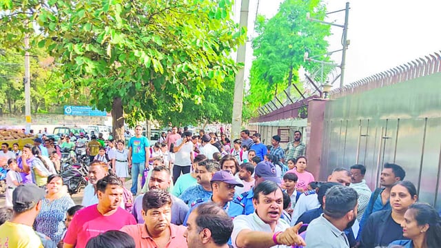 Parents outside the school during the protest. (HT Photo)