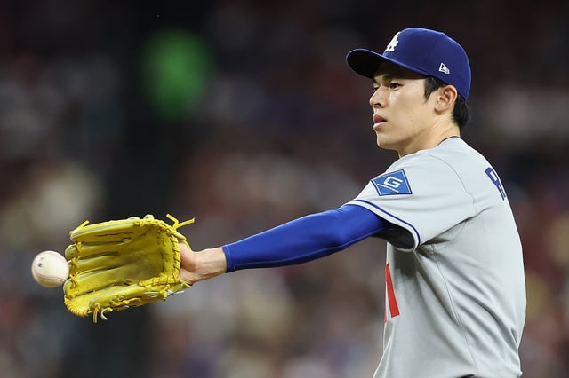 PHOENIX, ARIZONA - MAY 09: Starting pitcher Roki Sasaki #11 of the Los Angeles Dodgers reacts while pitching against the Arizona Diamondbacks during the fif inning of the MLB game at Chase Field on May 09, 2025 in Phoenix, Arizona.
