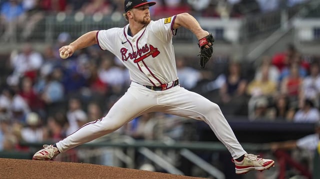 May 13, 2025; Cumberland, Georgia, USA; Atlanta Braves starting pitcher Spencer Schwellenbach (56) pitches against the Washington Nationals during the second inning at Truist Park. Mandatory Credit: Dale Zanine-Imagn Images