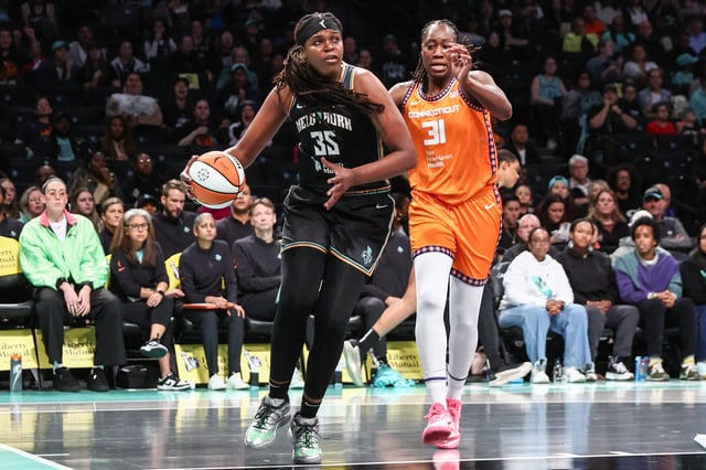 May 9, 2025; Brooklyn, NY, USA;  New York Liberty center Jonquel Jones (35) looks to drive past Connecticut Sun center Tina Charles (31) in the first quarter at Barclays Center. Mandatory Credit: Wendell Cruz-Imagn Images/File Photo