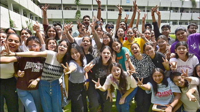 Class 12 students in a jubilant mood after the declaration of results in BCM Arya Model Senior Secondary School in Ludhiana on Tuesday. (Gurpreet Singh/HT)