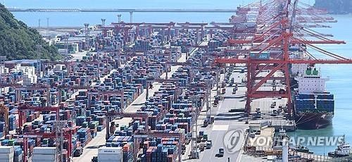 This Sept. 30, 2024, file photo shows shipping containers stacked at a port in the southeastern city of Busan. (Yonhap)